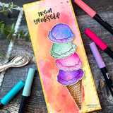 Tall slim card with a watercolor rainbow scoop tower and 'treat yourself' beside markers.