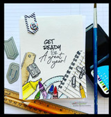 Card with the supplies border coloured along one corner on white, sentiment "GET READY for A great year!", with a paintbrush and ruler beside it.