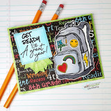 Card with a coloured backpack on a green panel over word-print paper, and a blue sentiment square reading "GET READY for A great year!"