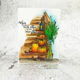 Card with the porch scene colored in warm orange pumpkins, blue lantern and green corn stalk, lettered 'When we have each other we have everything.'