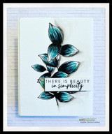 Blue-tipped leaf branch card with 'THERE IS BEAUTY in simplicity.'