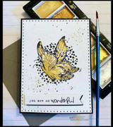The butterfly with gold accents on a black-splatter card, captioned "You are so wonderful."