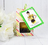 Lime green treat-box tag with the hands-on-hips gal in yellow
