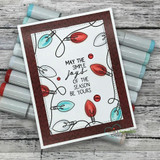 Handmade card featuring the string of vintage Christmas lights framing an A2 card, matted with a sentiment block, stamped with 'Merry winter wishes'.