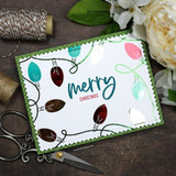 Colorful string-light garland with 'Merry Christmas.'