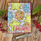 Colored ornaments and stars, 'Merry Christmas.'