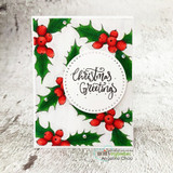 Wreath-style card of the holly and berries with 'Christmas Greetings.'