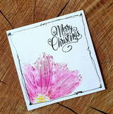 A full-panel daisy background hand-stamped on a card and lettered "Sending happy thoughts."