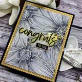 A full-panel daisy background stamped in red rubber and colored on a handmade card reading "Sending smiles."
