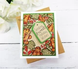 Small kraft and green card with the cookie border coloured softly in tan and red, and a die cut green tag carrying "Sending sweet Holiday Wishes" in the middle.