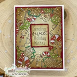 Deep red framed card on a wood slice, the cookie border coloured richly in browns, reds and greens with white enamel dots and "Sending sweet Holiday Wishes" in a cranberry centre panel.