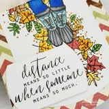 Card of sneakers and cropped jeans standing in colorful autumn leaves, 'distance means so little when someone means so much'.