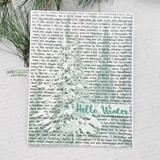Snow-white card with Christmas tree stamped over the carol-lyric text background — Hello Winter