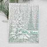 Snow-white card with Christmas tree stamped over the carol-lyric text background. Hello Winter.