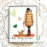 White card with the girl in an orange coat walking her dog, green hearts and 'Keep moving forward.'