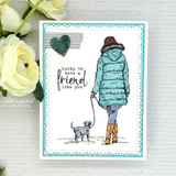 Card with the girl in a teal coat walking her gray dog and 'Lucky to have a friend like you.'