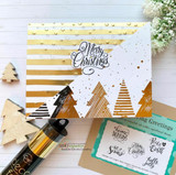 'Merry Christmas' foiled gold over patterned trees with matching mini cards.