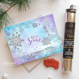 'happy HOLIDAYS' on a soft purple snowflake card.