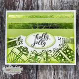 'holly Jolly' on an oval over green foiled gift boxes.