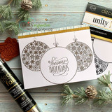 'happy HOLIDAYS' over stamped ornaments on a white card.