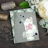 Plaid card of the cocoa mug with 'holly jolly.'