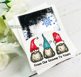 White card with three Santa-hatted gnomes and 'From Our Gnome To Yours' under an inky night sky.