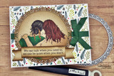 Card with the two friends colored in greens inside an arched frame on floral paper with a green bow, stamped 'We can talk when you need to, we can be quiet when you don't.'