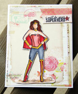 Layered card with the superhero girl colored in a red cape over jeans, stamped 'I will be your super hero' on a soft collaged background.