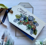 Tag with a blue-toned winter floral swag and pinecones and 'Winter wishes.'