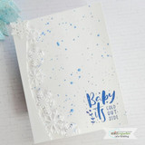 White embossed card with light-blue splatter and the itty bitty 'Baby it's cold outside' sentiment.