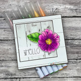 Wood-grain panel card with a magenta daisy and green patterned leaf and 'well HELLO'