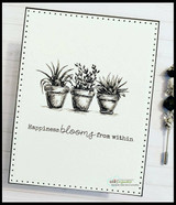 Clean card in a black frame with the three pots stamped in black on cream and 'Happiness blooms from within' below.