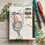 Jeanie Hays' gnome in a party hat sits in a wine goblet with 'party like it's gnome body's business,' a red rubber celebration stamp on a card.