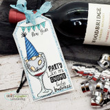 Jeanie Hays' gnome in a party hat sits in a wine goblet with 'party like it's gnome body's business,' a red rubber celebration stamp on a card.