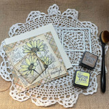 Vintage-style daisy card with layered papers, the sentiment “You are enough,” and coordinating Distress inks and crafting tools.