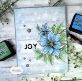 Handmade sample card using the White Winter papers — a watercolored blue poinsettia and a joy greeting on a starry snow-toned background.