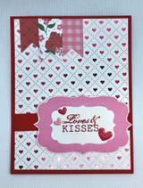 Handmade card made with Unity Stamp Co’s Criss Cross Hearts {background} red rubber background stamp — a full A2 background stamp of a criss-cross lattice filled with tiny hearts — layered behind the focal images and sentiment on this card.
