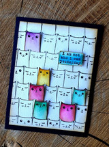 Card with the cats colored in rainbow pastels inside a navy frame, 'Happy You Day.'