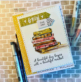 A girl holding a tall stack of books hand-stamped on a card and lettered "I love you more than books."