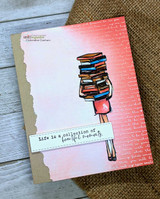 A girl holding a tall stack of books stamped in red rubber and colored on a handmade card reading "Hope your birthday is one for the books."