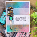 Handmade card featuring a girl holding a tall stack of books, with the sentiment "I love you more than books."