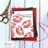 Handmade card with a bold lip-print kiss stamped in red, script sentiment 'Kiss the world with kindness' from the itty bitty collection.