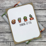 Clean white card with three small potted succulents and 'Thinking of you.'