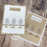 Two kraft and white cards with rows of slender bare trees, stamped 'GET WELL SOON.'