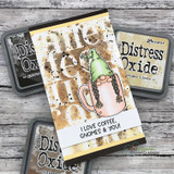 Handmade card featuring the gnomes tucked inside steaming coffee mugs, on a pink coffee-doodle background, stamped with 'Yawn Sip Repeat'.