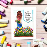 Card of the tulip girl standing in a flowerbed of bright tulips with 'The best time for new beginnings is now' on a blue banner.