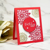 Red card with the doily stamped in white in the corner, 'Birthday wishes.'