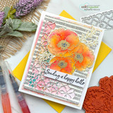 Card with the dashed background inked in warm grey behind embossed poppies and a pink floral die, sentiment 'Sending a happy hello'.