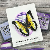 Card with a yellow butterfly over subtle stripes and "remember to breathe."