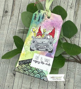 Watercolor tag with gnomes riding in a car among trees, stamped 'Life is short, enjoy the ride.'